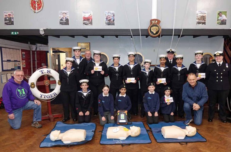 Cadets and adult volunteers at Leicester Sea Cadets gratefully receiving 7 x training AEDs, with thanks to the JHMT